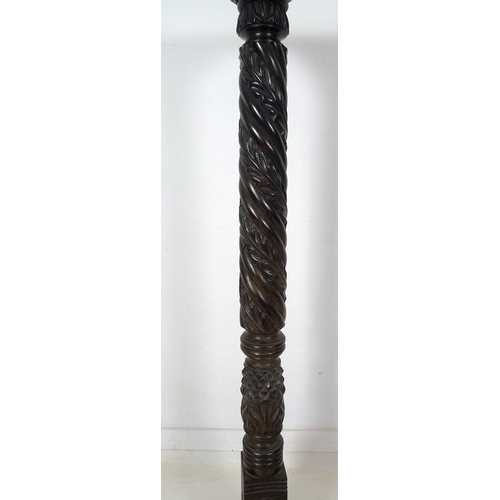 991 - An early 20th century ebonised wood jardiniere stand, with spiral carved column, square surface and ... 