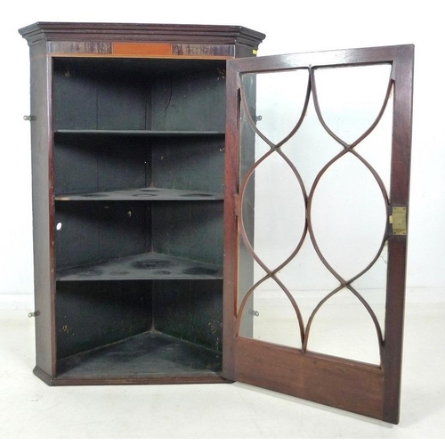 993 - A George III oak corner cupboard, with single astragal glazed door enclosing three shelves, 79.5 by ... 