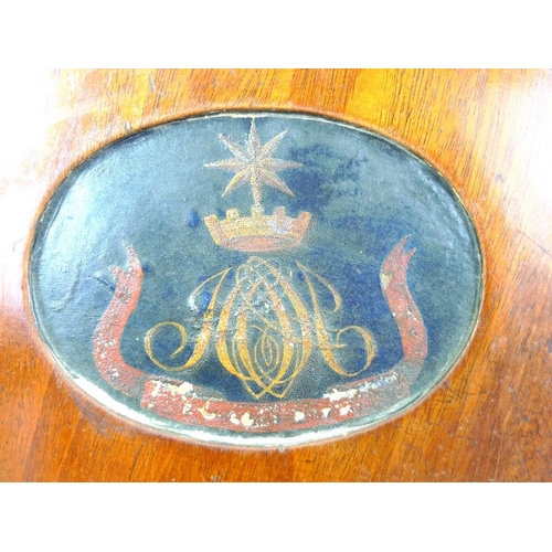 998 - A 19th century mahogany armorial hall chair, the shaped back carved and painted with the crest of th... 