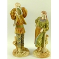 A pair of Royal Worcester shot enamel porcelain figures, modelled as Romanian peasants, circa 1895, ... 