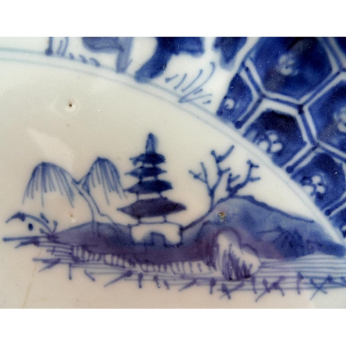 509 - A Chinese porcelain bowl, 19th century, decorated with blue fluted sides, painted panels depicting f... 