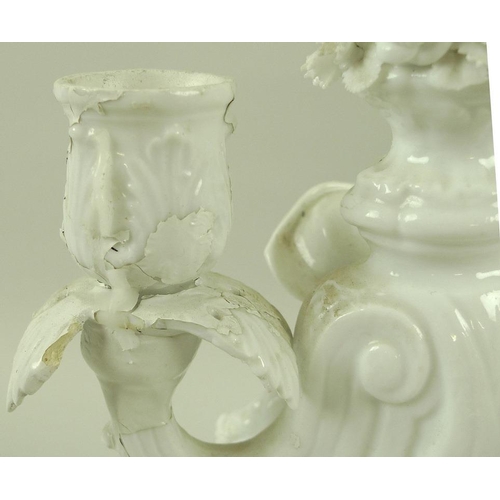 510 - A pair of Meissen porcelain twin branch candlesticks, each moulded with a child in late 17th / early... 