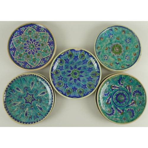 512 - A collection of mid 20th century Iznik style plates, all hand thrown and hand decorated, deep blue a... 