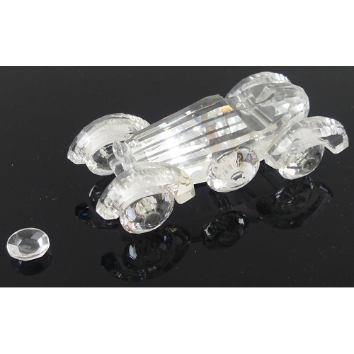 535 - A collection of Swarovski crystal miniatures, comprising train tender, 6cm, and carriage, 8cm, a spo... 