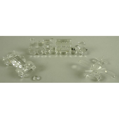 535 - A collection of Swarovski crystal miniatures, comprising train tender, 6cm, and carriage, 8cm, a spo... 