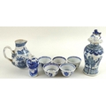 A collection of Chinese ceramics, including a 19th century jug, with twin strap handle terminating i... 