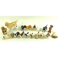 A collection of eighteen Beswick dogs, including dachshund, dalmation, beagle, pug, poodle, spaniel,... 