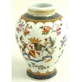 A small Chinese Export armorial porcelain baluster vase, mid 19th century, decorated with flowers an... 