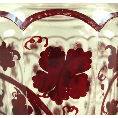 559 - A pair of Continental glass faceted jars and covers, late 19th century, decorated in dark red with s... 