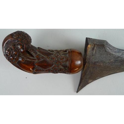 633 - An Indonesian Makassar Badik, together with a Malaysian Kris with intricately carved handle and unus... 