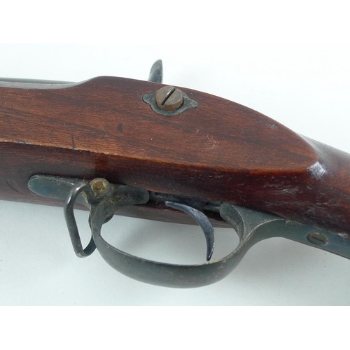 645 - A mid 19th century rifle, complete with ramrod and loops, barrel length 68cm, 125cm overall.