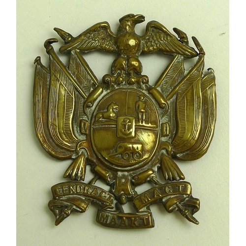 648 - A Boer War cap badge, circa 1890's, cast brass with eagle surmounting a crested cartouche, flanked b... 