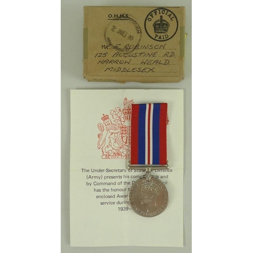 657 - A 1939-45 medal for Mr K. C. Lacey of the Military Police, together with a souvenir of voyage home a... 