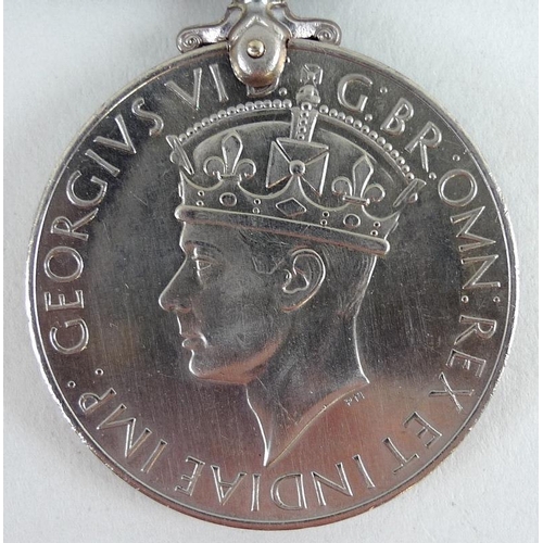 657 - A 1939-45 medal for Mr K. C. Lacey of the Military Police, together with a souvenir of voyage home a... 