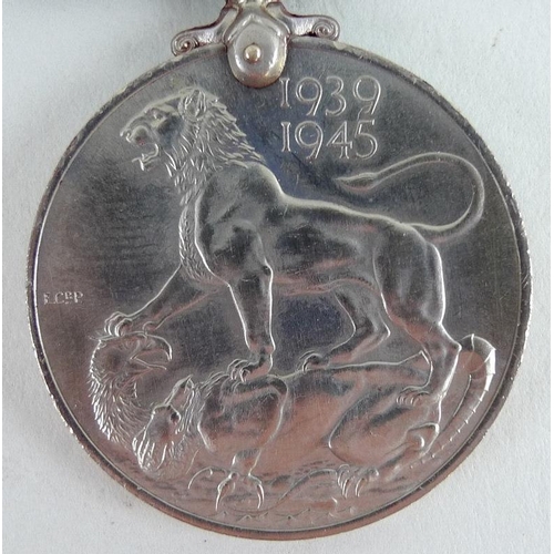 657 - A 1939-45 medal for Mr K. C. Lacey of the Military Police, together with a souvenir of voyage home a... 