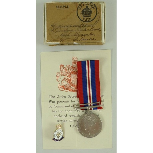 657 - A 1939-45 medal for Mr K. C. Lacey of the Military Police, together with a souvenir of voyage home a... 