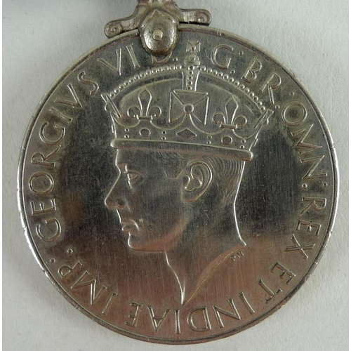 657 - A 1939-45 medal for Mr K. C. Lacey of the Military Police, together with a souvenir of voyage home a... 