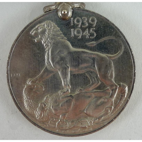 657 - A 1939-45 medal for Mr K. C. Lacey of the Military Police, together with a souvenir of voyage home a... 