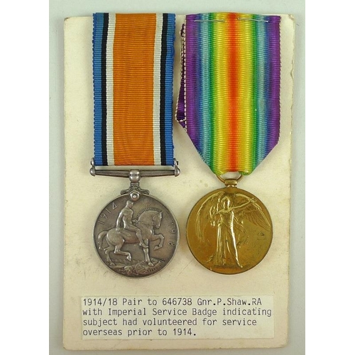 674 - A WWI pair of medals to Gnr. P. Shaw R. A. with Imperial Service Badge indicating the subject had vo... 