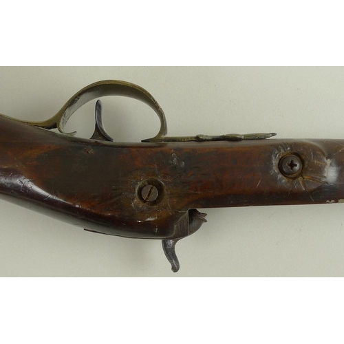 675 - An early 19th century percussion shotgun, with octagonal breech, damascus barrels, and brass trigger... 