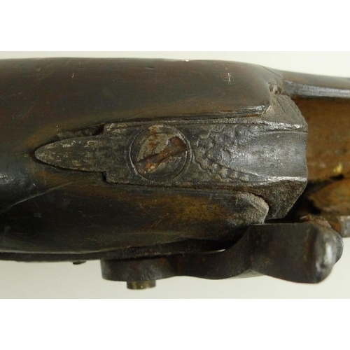 675 - An early 19th century percussion shotgun, with octagonal breech, damascus barrels, and brass trigger... 