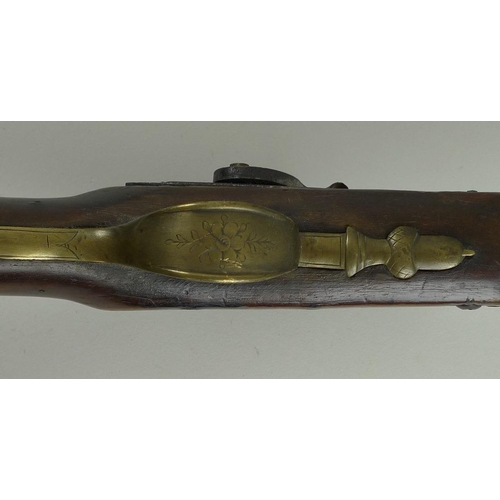 675 - An early 19th century percussion shotgun, with octagonal breech, damascus barrels, and brass trigger... 