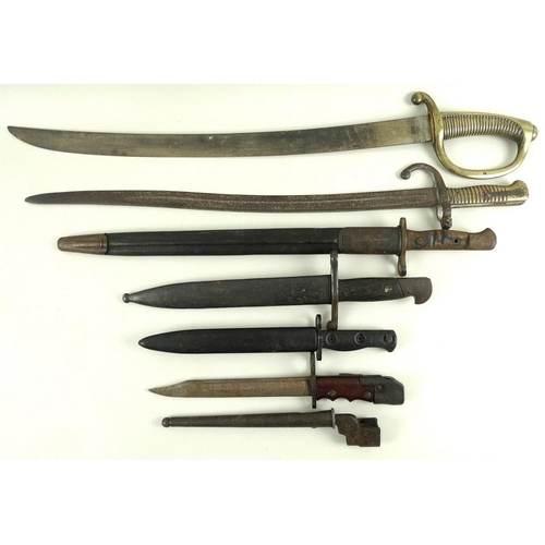 676 - A group of bayonets, 19th century and later, together with a cavalry officers sword, 74.5cm and smal... 