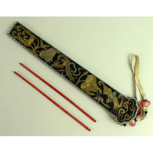 682 - A pair of Chinese flame coral chopsticks, 19th century, carved with spiral twist grips, 20.5cm, in a... 