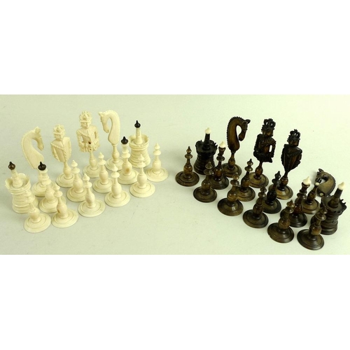 686 - An early 19th century carved bone chess set, possibly Canton, natural and brown/black stained, model... 