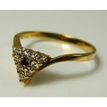 An 18ct gold ring, the unusual triangular form cluster set with central sapphire, approx 1.5mm diame... 