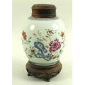 A Chinese porcelain ginger jar, 18th / 19th century, the body decorated with peonies and foliage, bl... 
