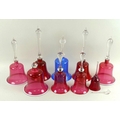 A collection of Victorian and later Bohemian ruby flashed bells, several with wrythen detailing, cle... 