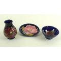 Three pieces of Moorcroft pottery, all Clematis pattern with cobalt blue background and deep purple ... 