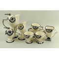 A Moorland Art Deco style part tea set with black and silver sun decoration to sinuous bodies, compr... 