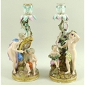 A pair of 19th century Meissen candelabra, one with scantily clad woman holding a sheaf of wheat bes... 