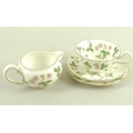 A Wedgwood part tea set, 'Wild Strawberry' pattern, R 4406, comprising four cups, 13 by 5.5cm, two s... 