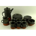 A 20th century studio pottery coffee set, comprising a coffee pot, 17 by 20.5cm, milk jug, 10cm, suc... 