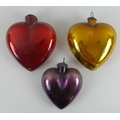 A set of three large vintage heart shaped foiled glass Christmas decorations, one red, another gold ... 