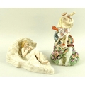 A 19th English porcelain figure of Neptune, a mythological giant fish by his side, both perched upon... 