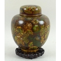 A Chinese cloisonne ginger jar and cover, enamelled with green, mustard and ombre tones, with a carv... 