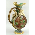 A Mintons majolica moonflask ewer, decorated with three putti and baccanalia, vine form handle, furt... 