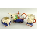 A Royal Venton ware teaset comprising a teapot, milk jug and sucrier, all modelled as elephants, the... 