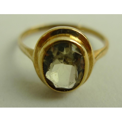 893 - A group of three 9ct gold dress rings, comprising a white gold and Swiss topaz solitaire ring, size ... 