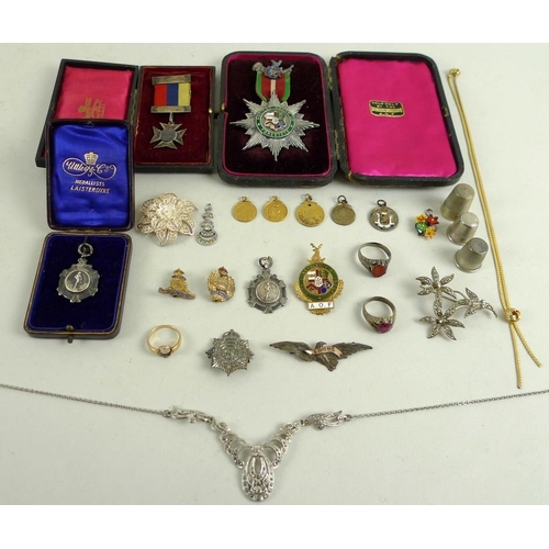 894 - A collection of bijouterie and medals, including an 18ct gold ring, the band engraved Omnia vincet a... 