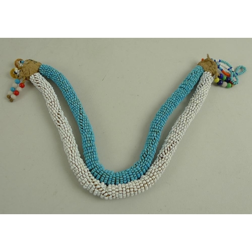 897 - An mid 20th century South African waist band, formed of a plaited band with turquoise and black bead... 