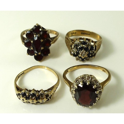 900 - A group of four 9ct gold dress rings, comprising a garnet cluster ring, size P, a sapphire and diamo... 