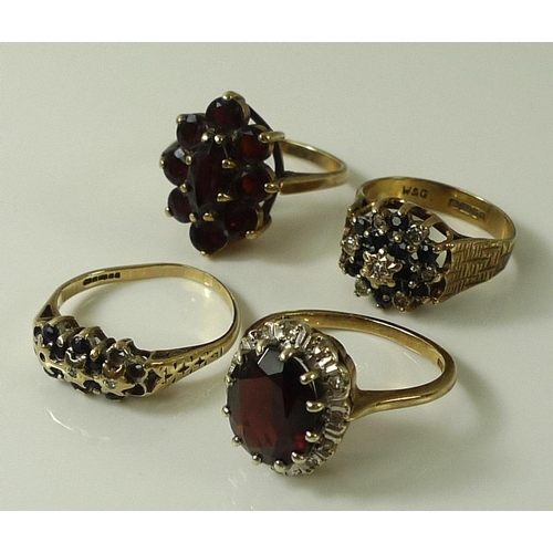 900 - A group of four 9ct gold dress rings, comprising a garnet cluster ring, size P, a sapphire and diamo... 