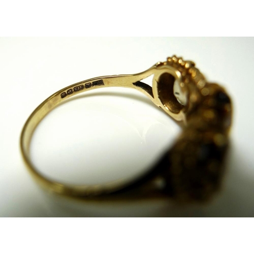 906 - A 9ct gold and yellow topaz ring, the three oval stones each 7.7 by 5.2 by 3.3mm and mounted in a ro... 