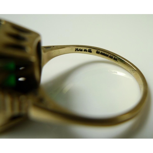 911 - A 9ct gold ring set with a green abraded glass, emerald cut, size N/0, together with a gold and ambe... 