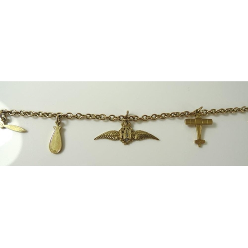 912 - A 9ct gold RAF sweetheart charm bracelet with five 9ct gold charms, including wings, plane and prope... 